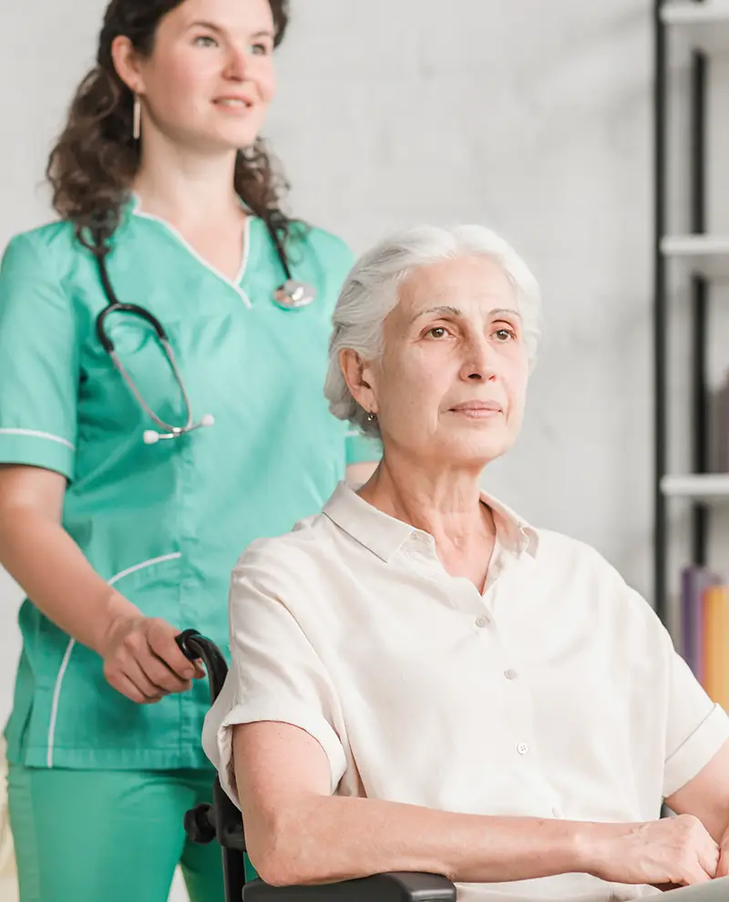 young-nurse-assisting-disabled-senior-woman-sitting-wheel-chair